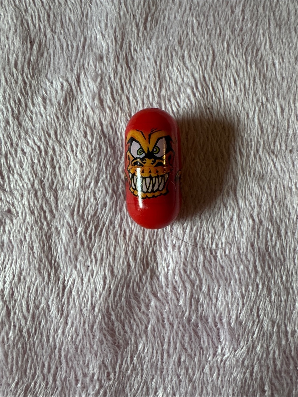 be a 2004 Ja-Ru Mighty Beanz T-Rex collectible toy bean.